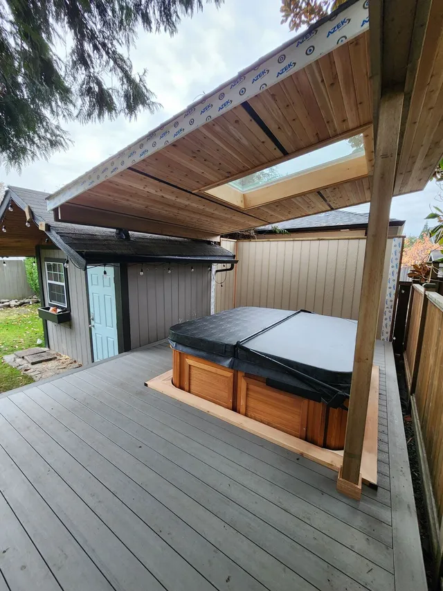 Finished composite deck with cedar roof structure built by Valart Solutions in Tsawwassen